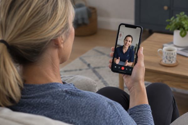 Patient on video call with therapist
